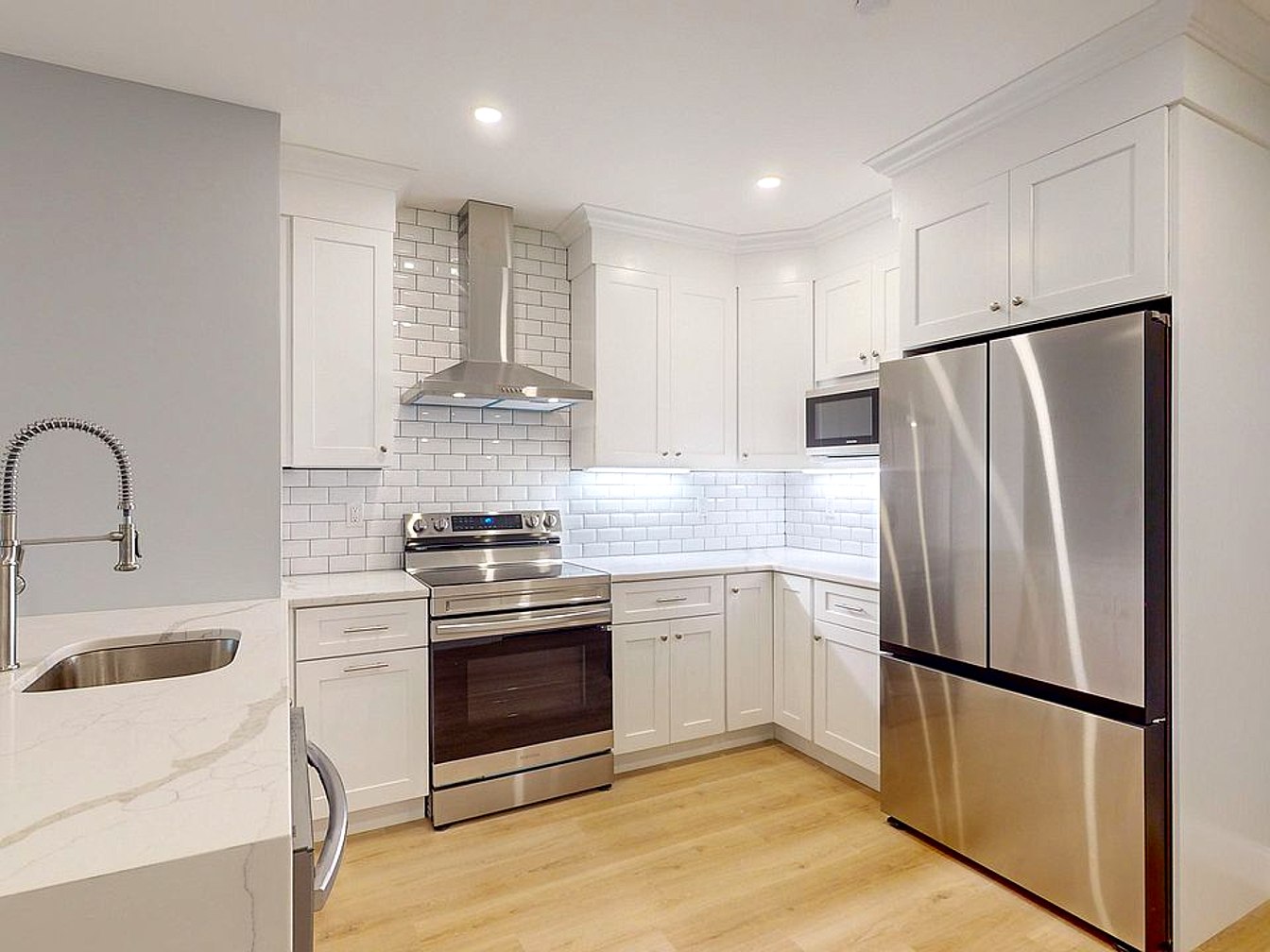 The Vanguard — kitchen with stainless appliances